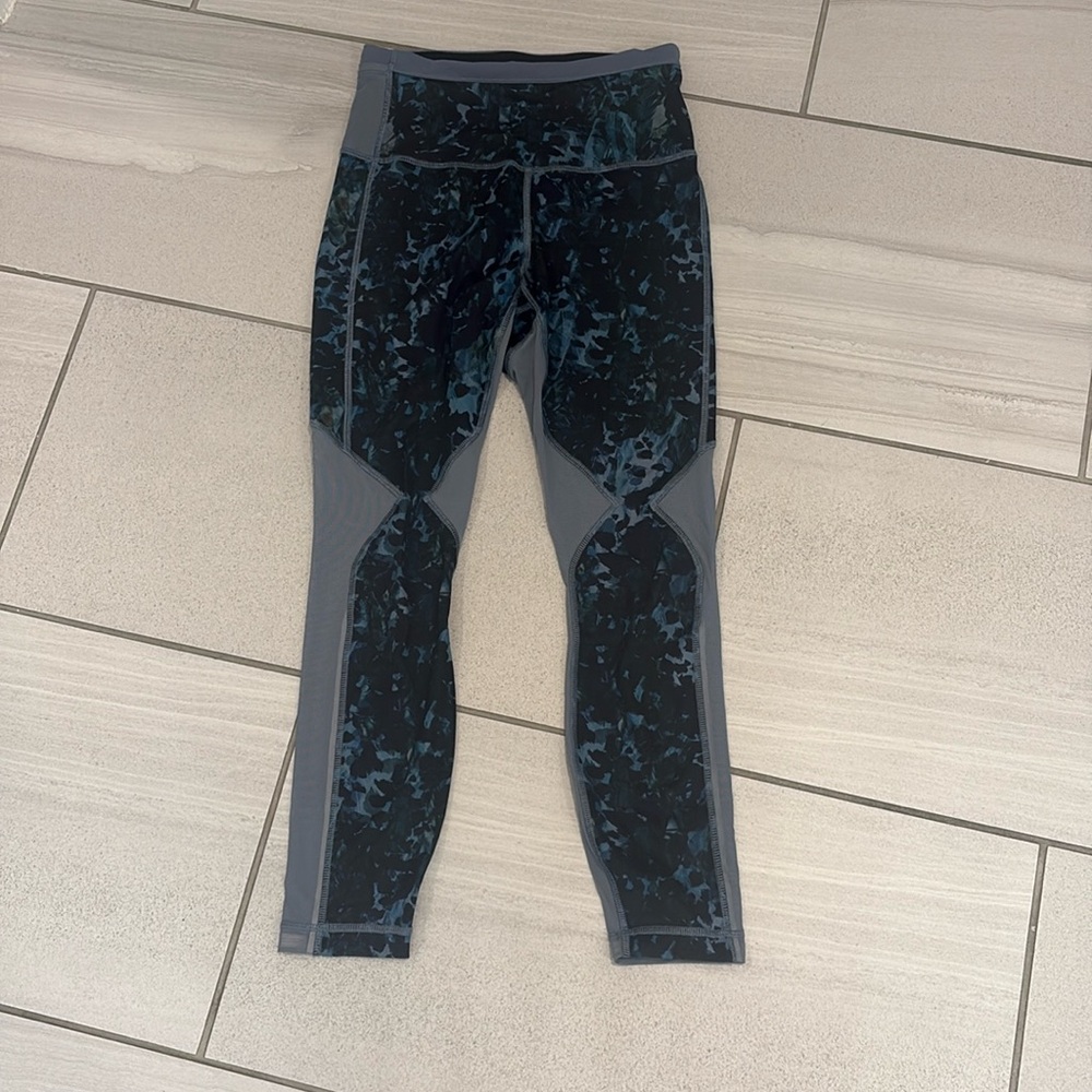 Lululemon tights patterned  with mesh inserts.